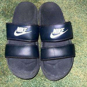 Worn Nike slides
